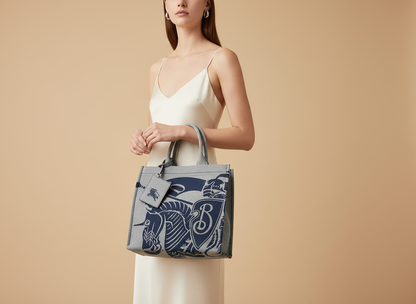 Burberry Navy EKD Canvas Tote Bag With Coin Pouch — held by model in studio