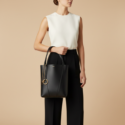 Chloé Spin Black Calf Leather Shoulder Bag — held by model in studio