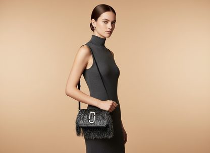 Marc Jacobs The Snapshot Creature Black Fur and Leather Crossbody Bag — held by model in studio