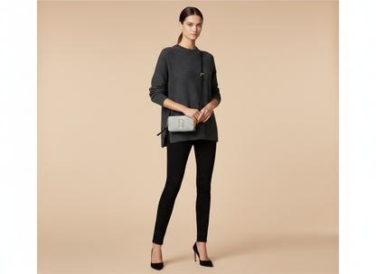 Marc Jacobs The Snapshot New York Crossbody Bag — held by model in studio