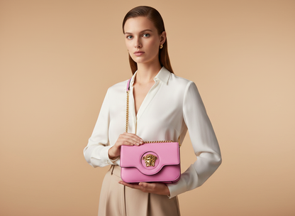 Versace La Medusa Pink Leather Shoulder Bag — held by model in studio