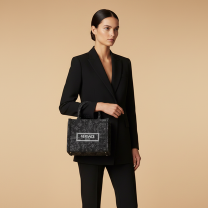 Versace Athena Black Barocco Jacquard Tote Bag — held by model in studio