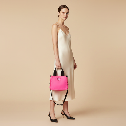 Marc Jacobs The Small Tote Neon Fuchsia Nylon Tote Bag — held by model in studio
