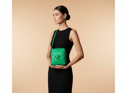 Versace Medusa Bright Green Nylon Crossbody Bag — held by model in studio