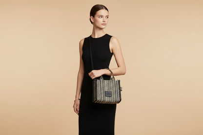 Marc Jacobs The Monogram Beige Mini Tote Woven Jacquard Canvas Crossbody Handbag — held by model in studio