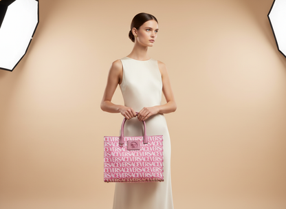 Versace Medusa Large Canvas Large Tote Bag Baby Pink — held by model in studio