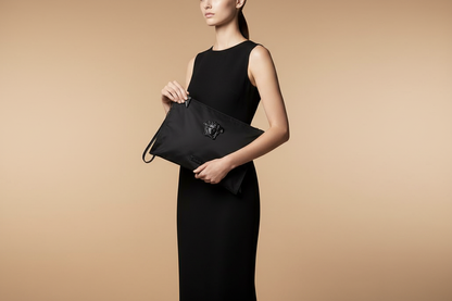Versace Medusa Black Nylon Clutch — held by model in studio