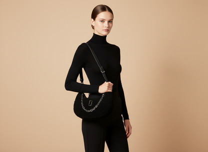 Marc Jacobs The Teddy Curve Bag Black Faux Shearling Shoulder Bag — held by model in studio