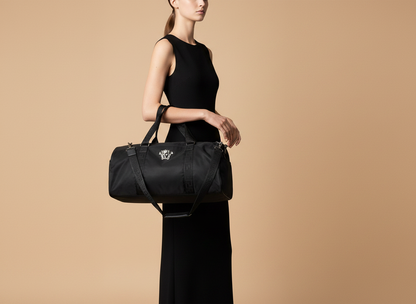 Versace Medusa Black Nylon Duffle Bag — held by model in studio