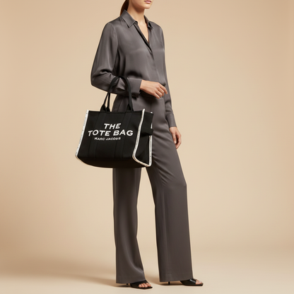 Marc Jacobs The Tote Bag Black Fabric Shoulder Bag — held by model in studio