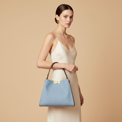 Fendi Way Medium Blue Denim Top-Handle Bag — held by model in studio