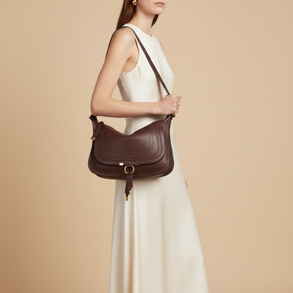 Chloé Marcie Bordeaux Calfskin Shoulder Bag — held by model in studio
