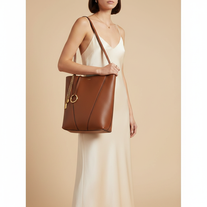 Chloé Spin Brown Calfskin Shoulder Bag — held by model in studio