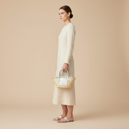 Jacquemus Le Panier Solis Beige Raffia Handbag — held by model in studio