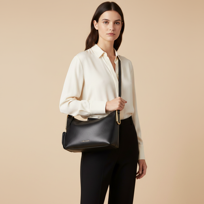 Marc Jacobs The Juliette Black Calf Leather Shoulder Bag — held by model in studio