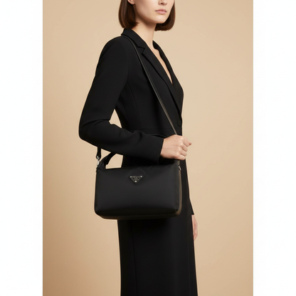 Black Recycled Polyamide Handbag — held by model in studio