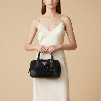 Prada Black Sequined Fabric Top-Handle Bag — held by model in studio