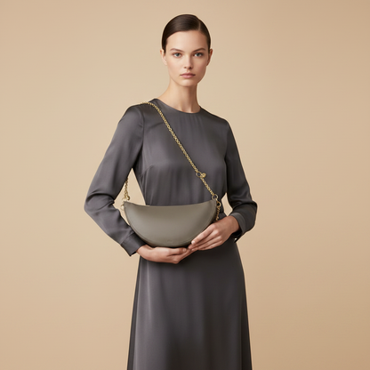 Gray Calf Leather Bos Taurus Shoulder Bag — held by model in studio